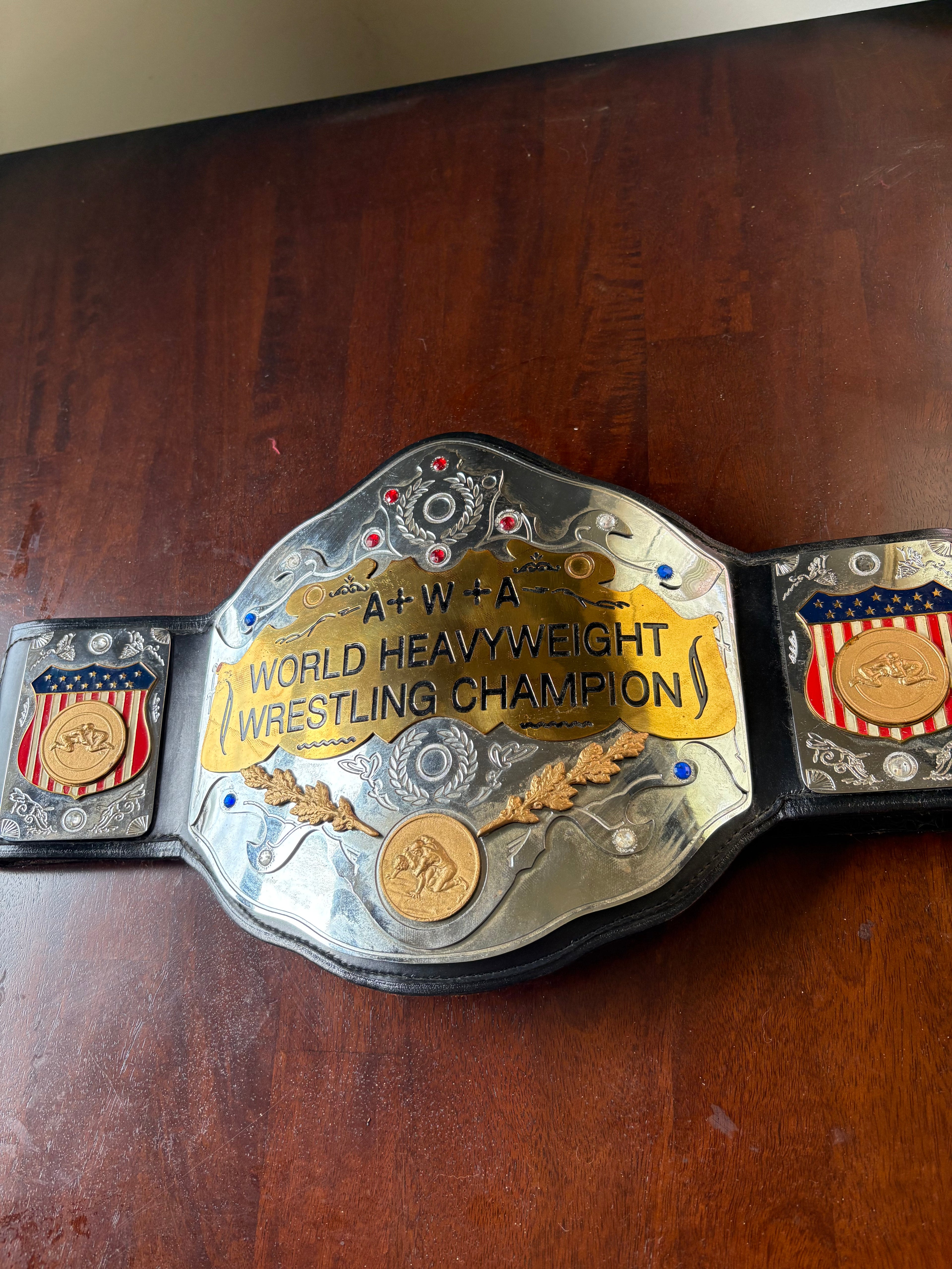 AWA World's title Belt Held by Brian Logan