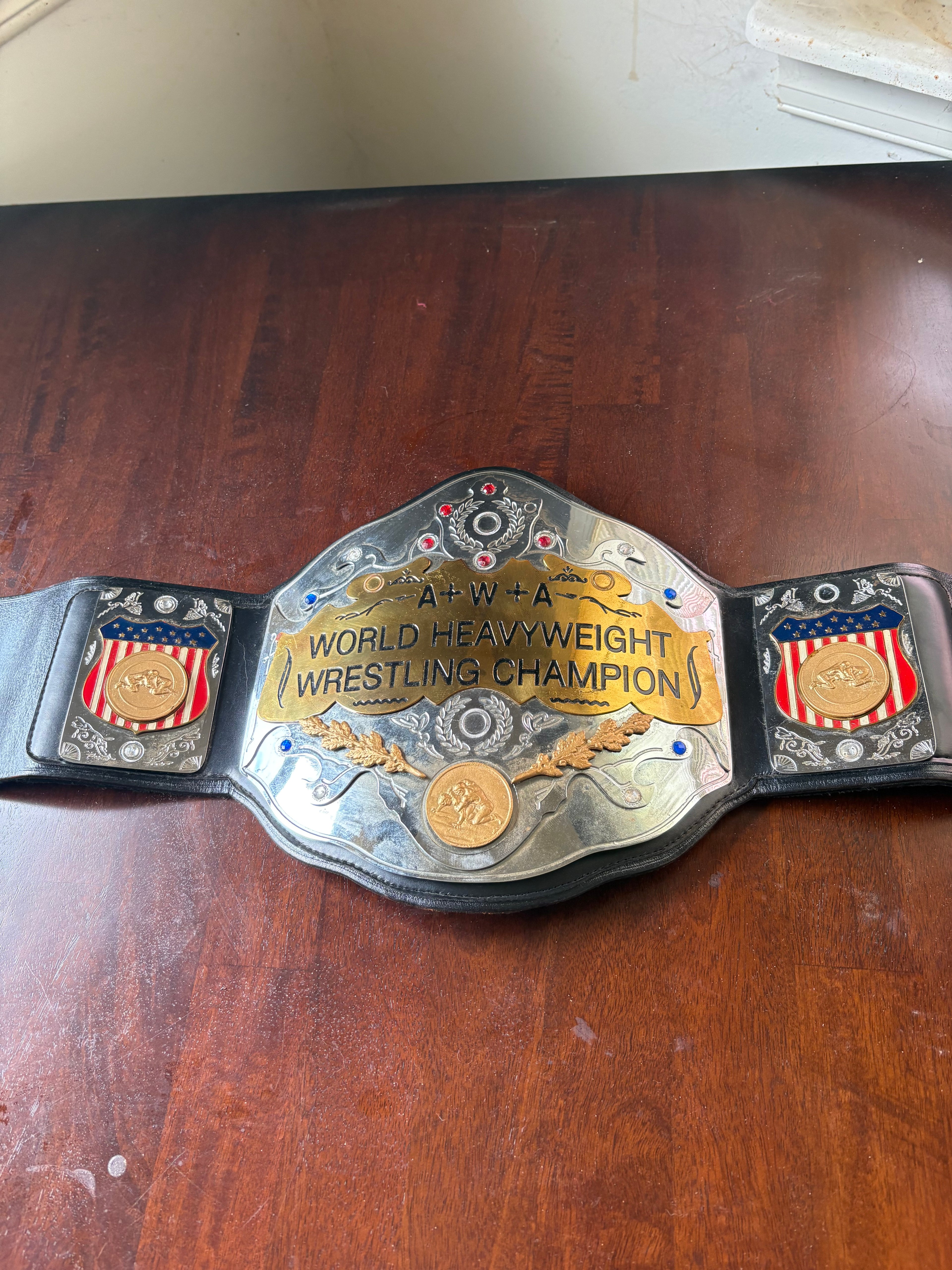 AWA World's title Belt Held by Brian Logan